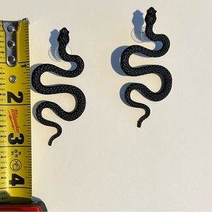 Black metal snake earrings